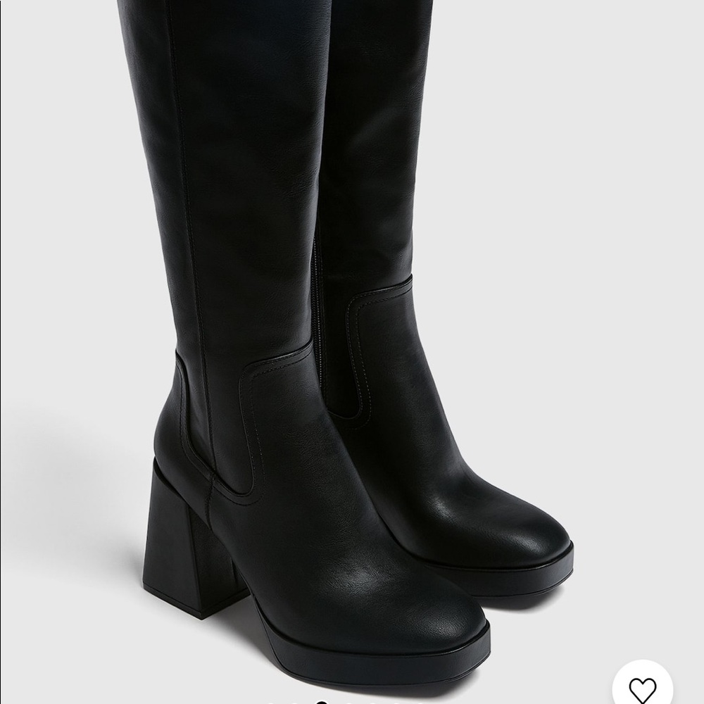 brand new knee high black boots.